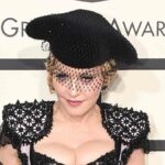 Madonna Poses Topless in Gold Corset
